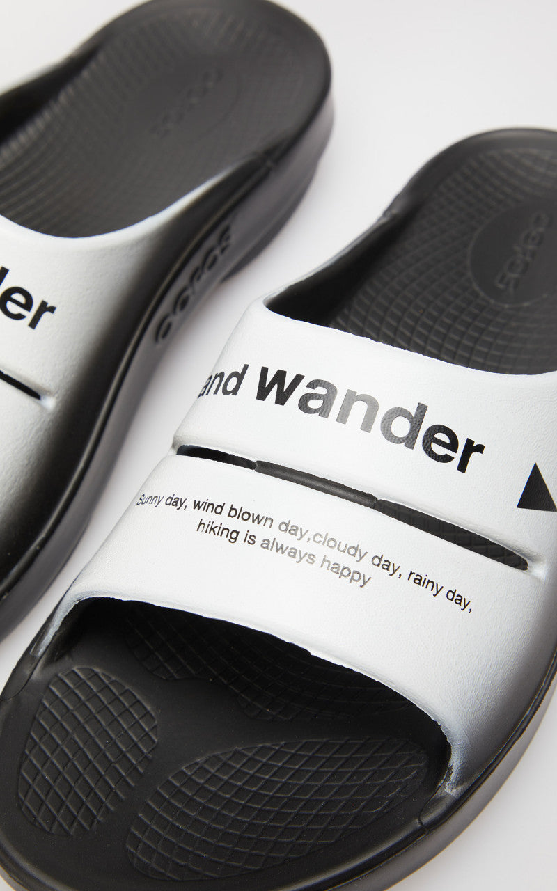 and wander x OOFOS Ooah Slide Black/White